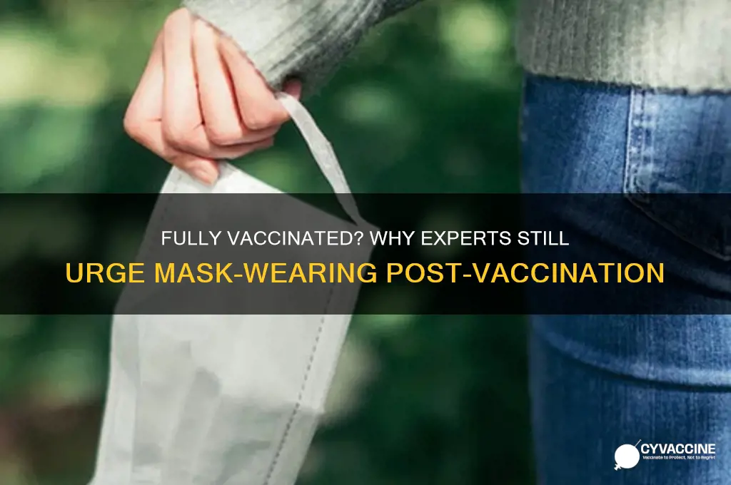 who urges fully vaccinated to continue to wear masks